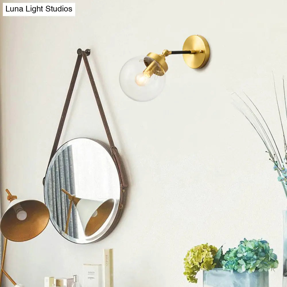 DecorBites™ DecorBites™ Simplicity Adjustable Globe Sconce Light Brass Wall Mount Lamp - 1 Bulb with Transparent Glass Shade