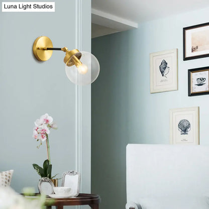 DecorBites™ DecorBites™ Simplicity Adjustable Globe Sconce Light Brass Wall Mount Lamp - 1 Bulb with Transparent Glass Shade