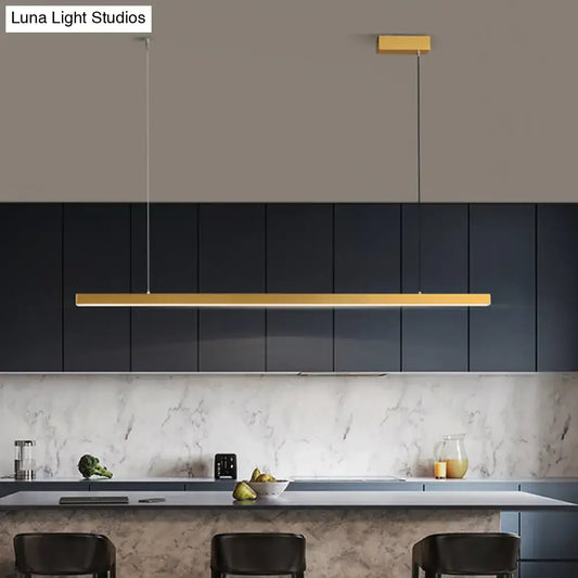 Gold-finished rectangular simplicity led metal pendant lighting with bulb included hanging above dining room island