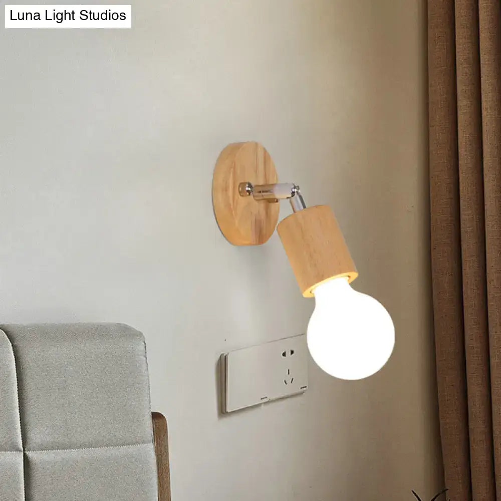 A warm-toned wooden wall sconce with a sleek chrome arm and an open bulb mini rotating light for bedroom use