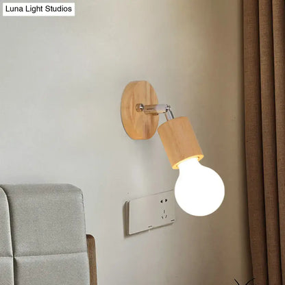 A warm-toned wooden wall sconce with a sleek chrome arm and an open bulb mini rotating light for bedroom use