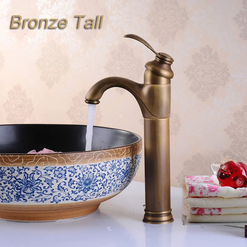 Bronze single hole deck mounted retro style vessel sink faucet in antique brass with sleek curved spout and elegant handle