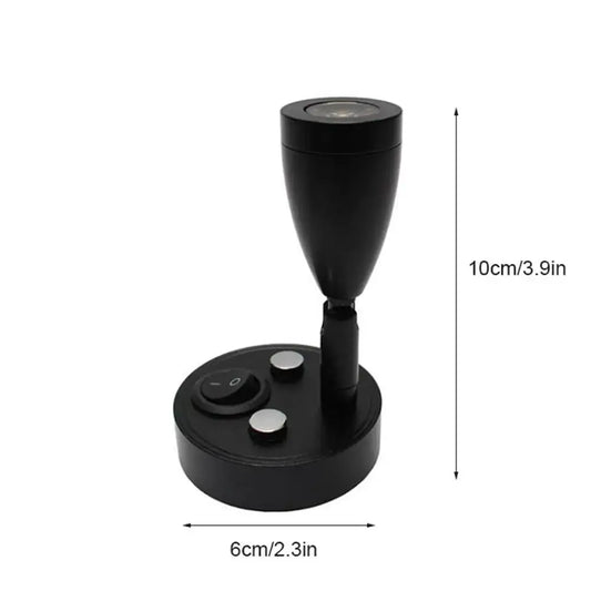 Sleek black adjustable led reading lamp with circular base and silver buttons for rv and bedroom interior use