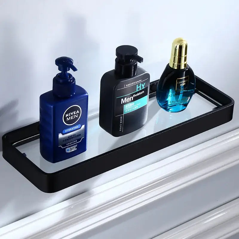 Black aluminum glass shelf with sleek metal frame holding three grooming products for bathroom storage decorbites black aluminum
