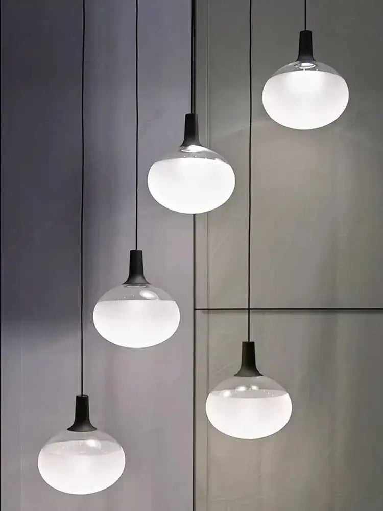 Sleek black cob led chandelier with frosted glass globes and matte fixtures for chandelier lighting hanging use
