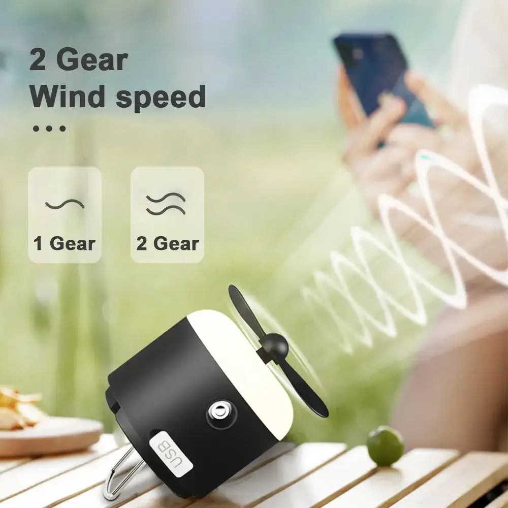 Sleek black and cream rechargeable led camping lantern with usb-powered mini fan and two adjustable wind speed settings
