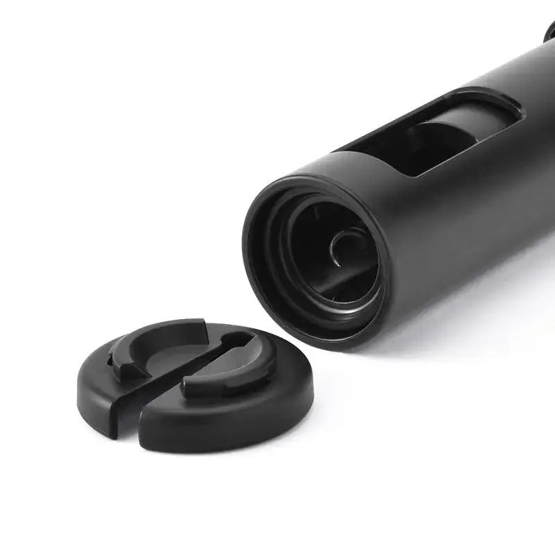 Sleek black cylindrical camera lens cap with clip mechanism featured alongside decorbites corkscrew premium kitchen tool