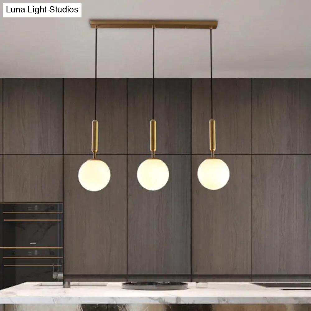 Sleek Brass Ball Pendant Light for Open Kitchen - Simplicity Glass Ceiling Fixture