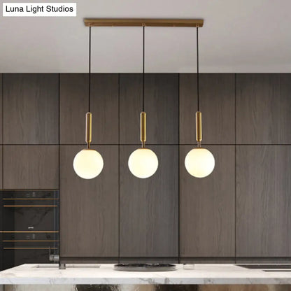 Sleek Brass Ball Pendant Light for Open Kitchen - Simplicity Glass Ceiling Fixture