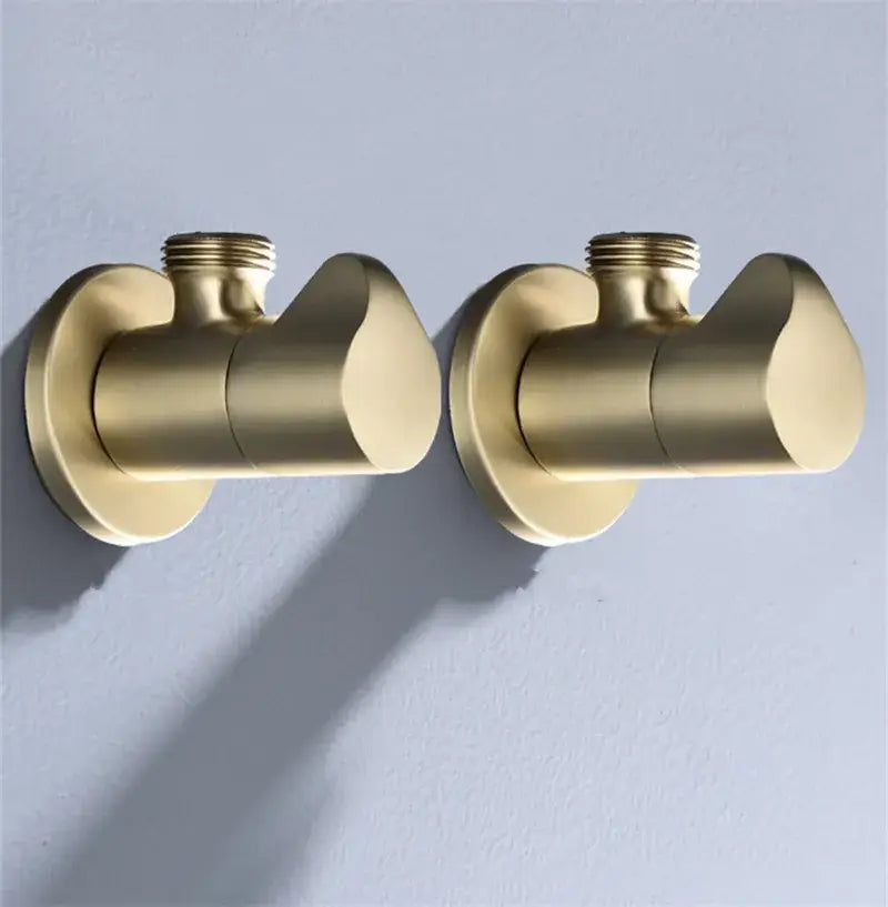 Pair of brushed gold corner valve water control taps with sleek modern design for bathroom installation