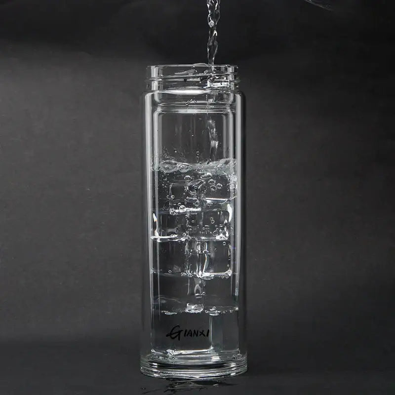 Sleek clear double-walled glass water bottle with filter and minimalist gianxi branding near its base for kitchen use