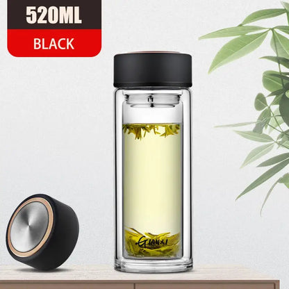 520ml black double-walled glass water bottle with sleek lid and silver accent filled with green tea leaves for kitchen use