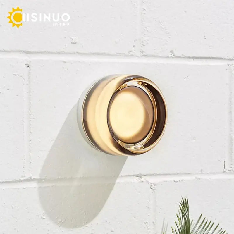 Gold-finished round wall sconce soap dish with sleek modern design and glass round wall feature for bathroom use