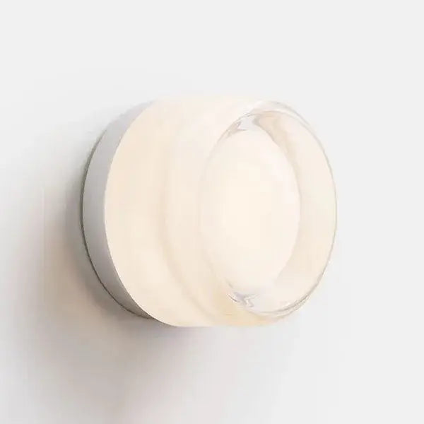 Modern minimalist round wall sconce with frosted glass diffuser and sleek gold metallic base for bathroom use