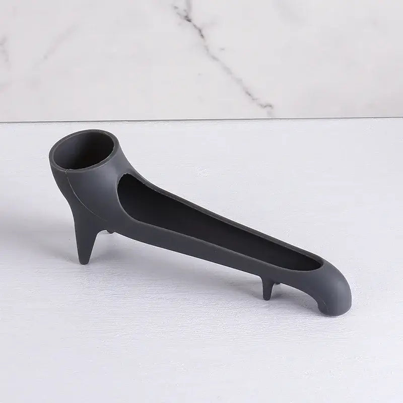 Black silicone high-heeled shoe bottle opener shown with sleek gray silicone water tank deflector for kitchen use