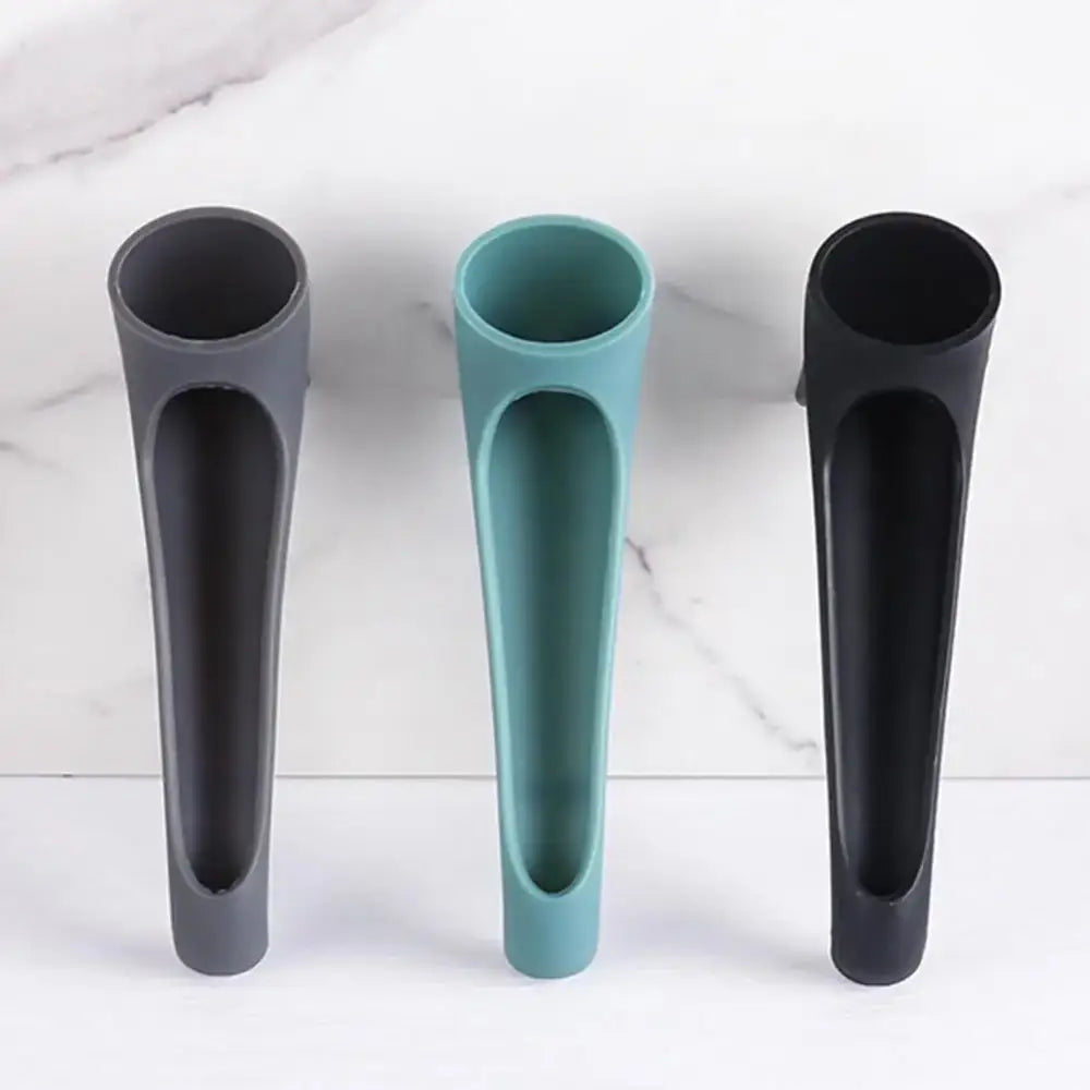 Three sleek modern silicone water tank deflector utensil holders in matte gray teal and black for kitchen use
