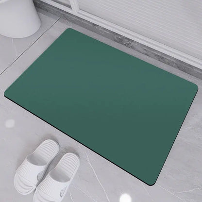Sleek sage green diatom ooze bath rug with smooth non-slip surface and rounded corners for bathroom use