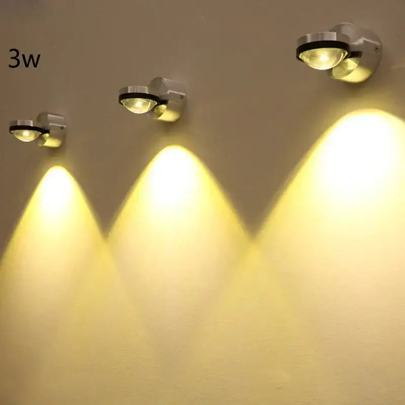 Three sleek silver and black crystal led wall lights with warm yellow light perfect for living room decorbites crystal led