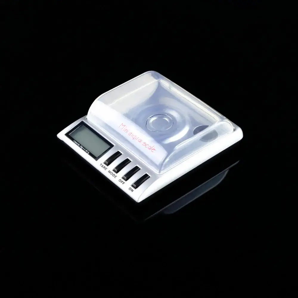 Sleek silver decorbites digital milligram gram scale with white body, clear plastic platform, and four black buttons for precision weighing