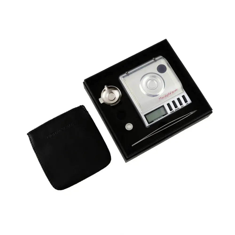 Silver decorbites digital milligram gram scale with clear cover black buttons and matching black carrying case for precision use