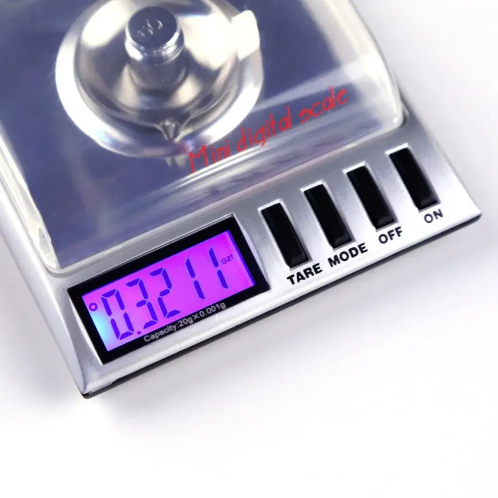 Sleek silver decorbites digital milligram gram scale with clear plastic platform and purple backlit lcd display for precision weighing