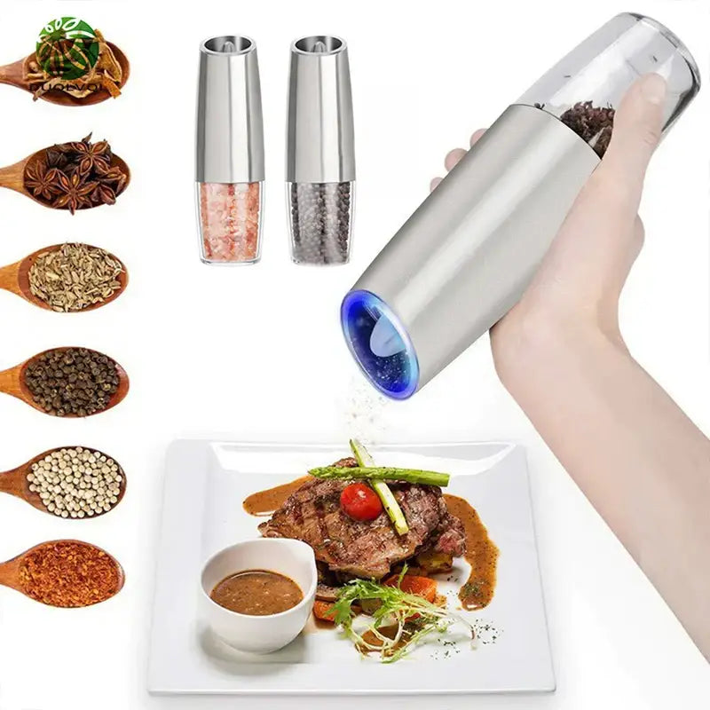 A sleek silver electric pepper mill with transparent top and blue accent in a salt grinder set for kitchen use