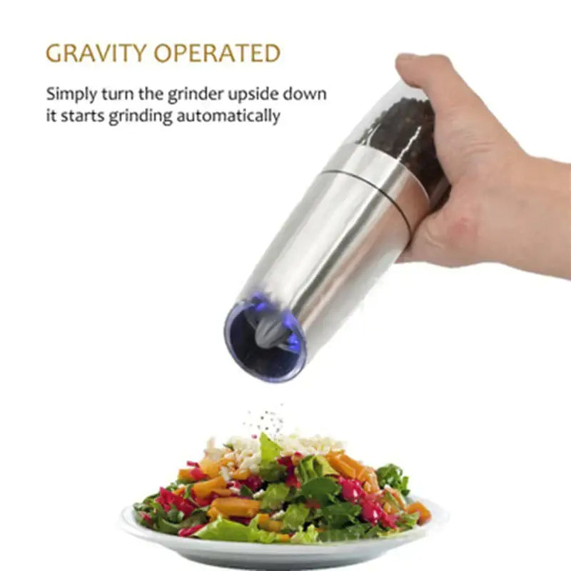 Sleek silver stainless steel electric pepper and salt grinder set with gravity operation and blue led light base