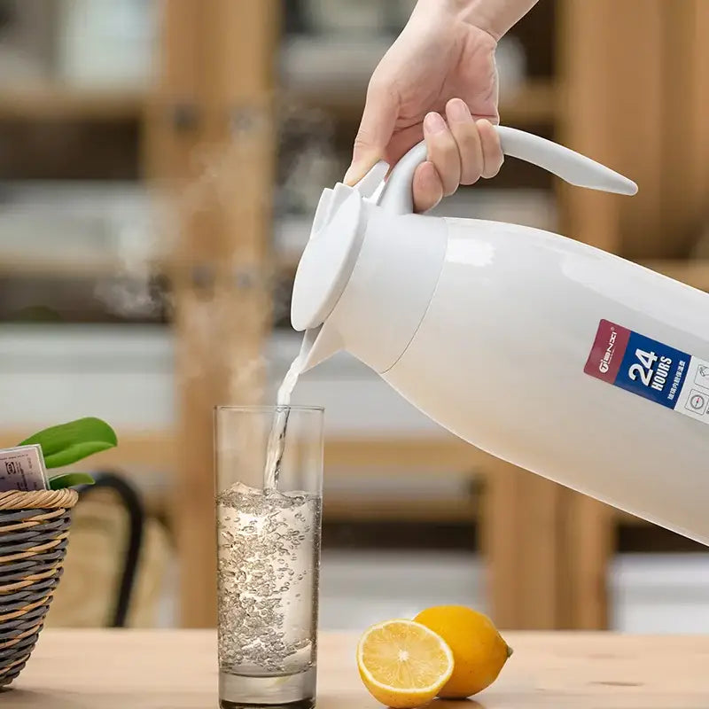White ceramic thermal carafe with sleek handle for easy pouring in the decorbites insulavacuum bottle collection