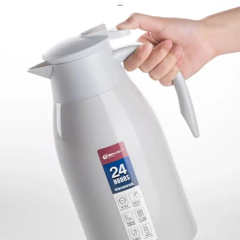White insulated decorbites insulavacuum bottle with sleek modern design stainless steel lid and handle for kitchen use