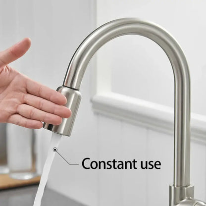 Sleek silver stainless steel kitchen faucet with curved spout and pull-down spray head with usb charging adapter