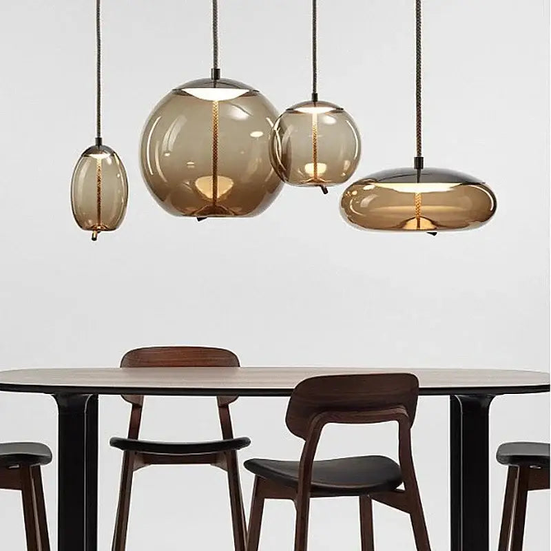 Set of four amber-tinted sleek smoked glass led chandelier pendant lights for living room and dining table use