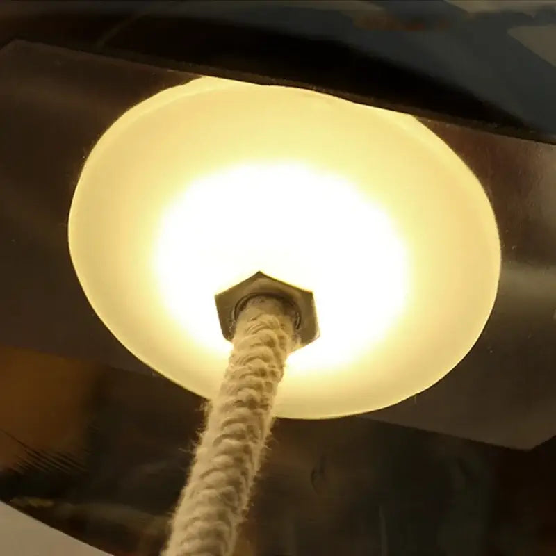Warm-toned frosted glass led chandelier with hexagonal metal fixture and braided rope for living room lighting
