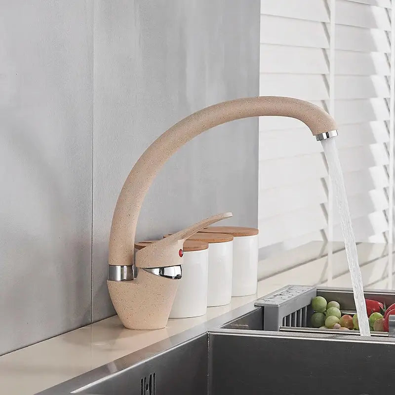 Beige speckled ceramic single handle kitchen faucet with sleek curved spout and polished chrome accents decorbites black single