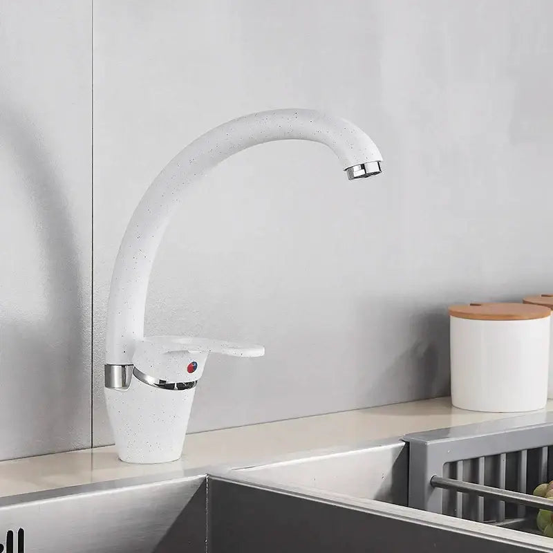 Sleek speckled black and chrome single handle kitchen faucet with white speckled curved spout decorbites black single