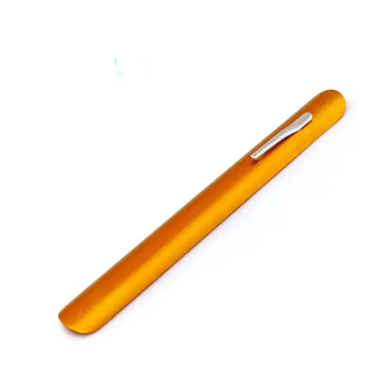 A sleek translucent orange crumb cleaner pen with a silver clip for decorbites crumb cleaner cake tool use
