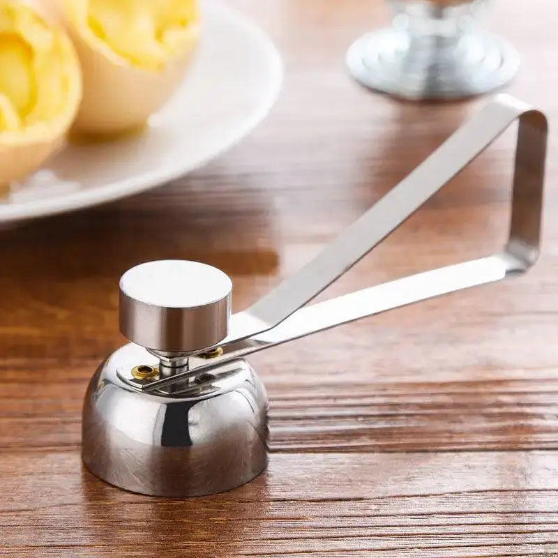 Shiny stainless steel egg topper set with curved handle and rounded base for precise kitchen cutting tasks