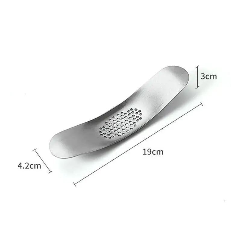 Sleek stainless steel garlic press by decorbites with curved design and evenly spaced perforations for efficient crushing