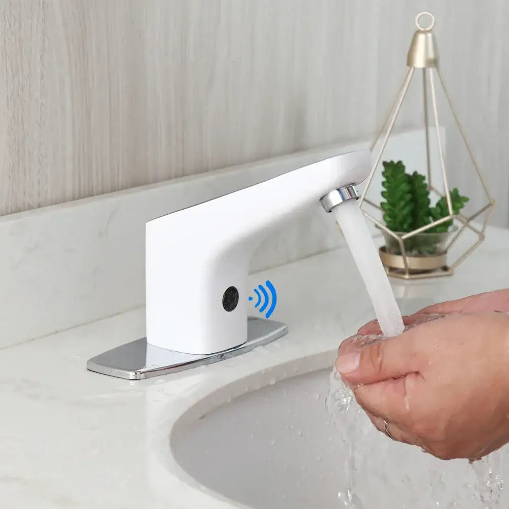 Sleek white automatic sensor bathroom faucet with chrome base and modern curved design sensor bathroom faucet