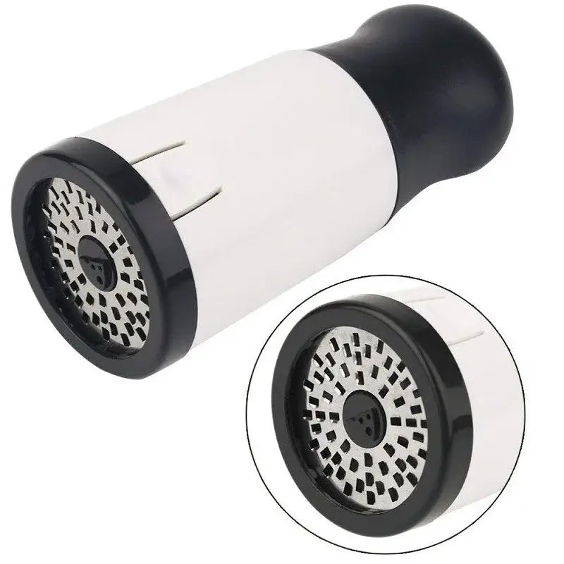 Sleek white and black decorbites herb grinder with textured grip and perforated metal surface for kitchen use