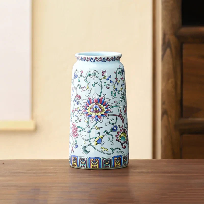 Small ceramic porcelain vase with vibrant pink blue and yellow floral patterns for elegant vintage home decor
