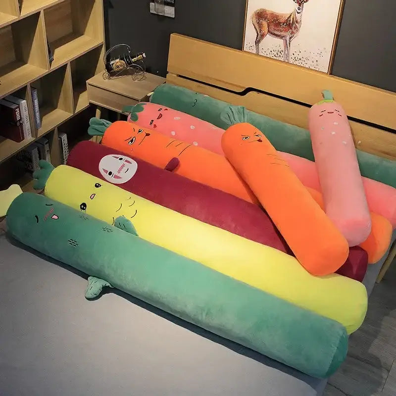 A collection of colorful plush smiling carrot orange and green decorbites cylindrical long pillows for bedroom decor