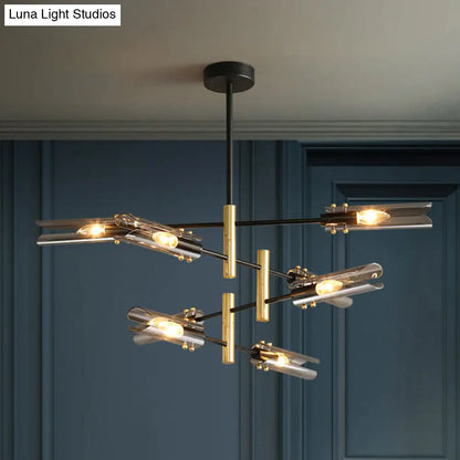 Lámpara de techo tubular moderna de cristal gris humo con 8 luces y acabado en negro y latón.