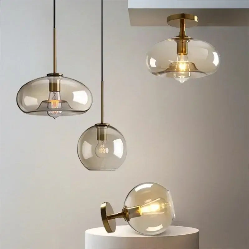 Modern smoked glass pendant light with brass accents for dining room featuring elegant glass pendant design