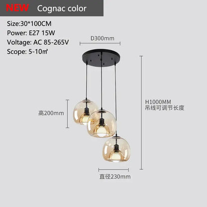 Cognac-colored glass pendant lights with three spherical shades and black ceiling mount for dining table lighting