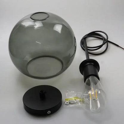 Smoky gray five light pendant light with gray spherical glass lampshades and iron finish metal mounting base light source