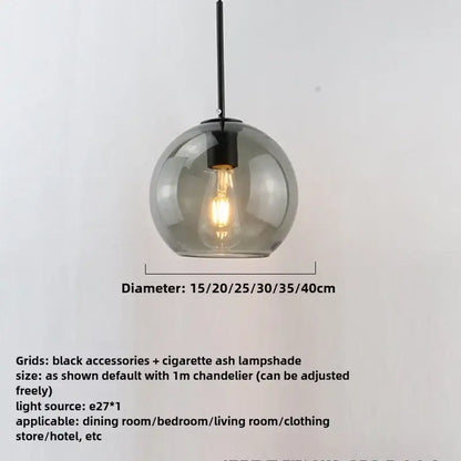 A smoky gray five light glass globe pendant light with smoked finish and iron finish black metal hardware as light source