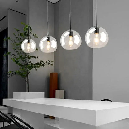 Smoky gray five light glass globe pendant light with exposed filament bulbs and iron finish cord pendant for dining room