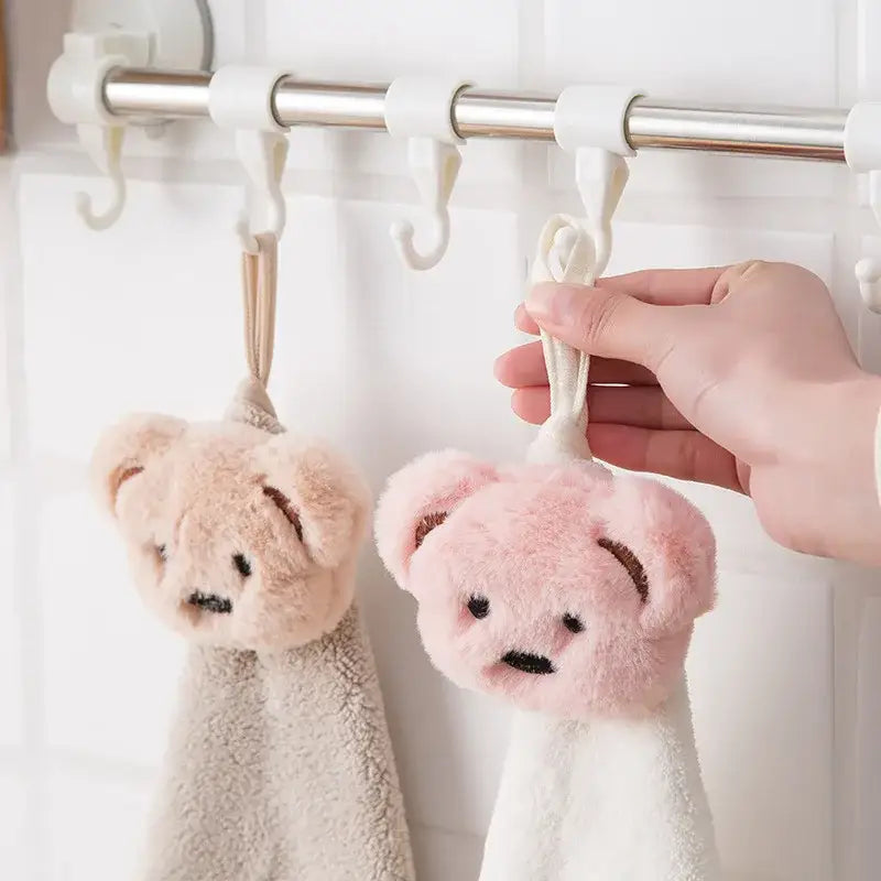 Soft cartoon bear hand towels in pink and beige microfiber with plush texture hanging on hooks decorbites cartoon bear