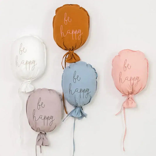 Soft cotton balloon wall hanging in pastel earthy tones with be happy embroidery for kids room decor