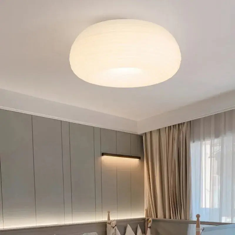 Soft cream apple paper pendant light with a frosted white smooth dome design by decorbites cream for bedroom decor